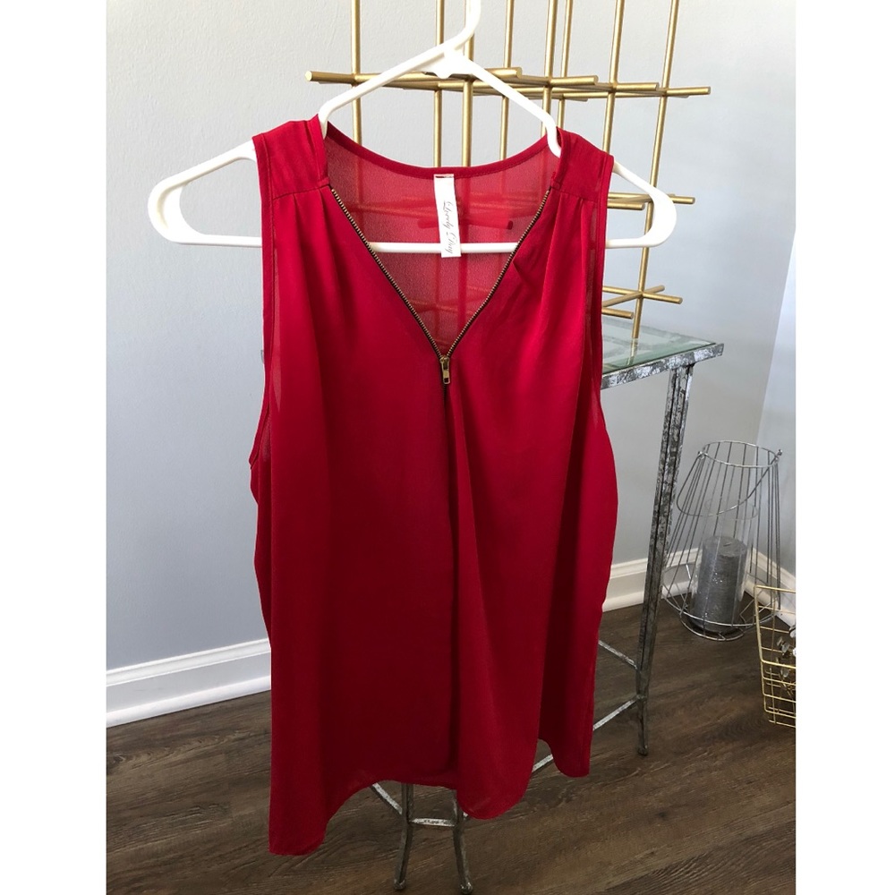 Red zip up blouse.